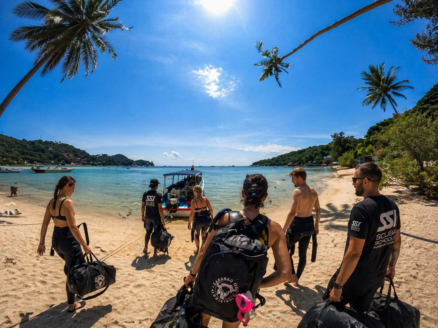 Divers exploring a reef off Koh Tao on a fun dive with Carabao